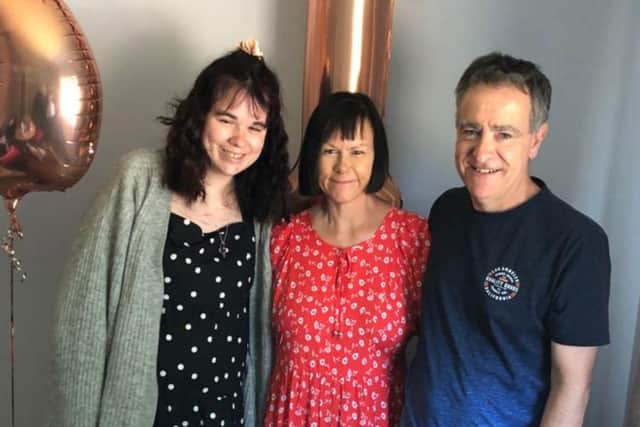 Hannah Aitken with her parents on her 21st birthday. (Credit: Leigh Day/ Aitken Family)