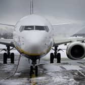 Heavy overnight snow has caused several major UK airports to close their runways. Picture by OLI SCARFF/AFP via Getty Images