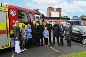 Left to right: Krissie Stiles and Alison Tweddle, Children’s Burns Trust; QVH Staff Nurse Carol Lehan; West Sussex Fire and Rescue Service firefighters with burns patient Tom Murrel at the front; QVH Deputy Ward Manager Sue Hallifax, and Carol Murrel, Tom’s mum. Photo: Queen Victoria Hospital NHS Foundation Trust