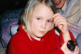 Mollie as a youngster with one of her pet rats - Animal News Agency