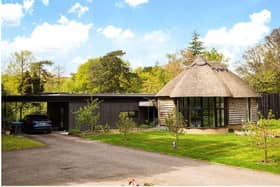 Lake Cottage at Smallfield is set in nearly five acres of grounds and is on sale through agents Savills with a guide price of £1,500,000