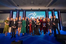 Staff from Air Ambulance Charity Kent Surrey Sussex with Charlotte Hawkins and other winners on stage.