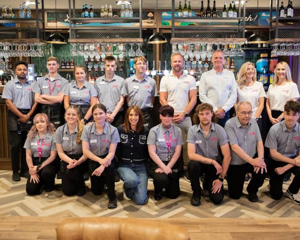 Team line-up: Alex Jones meets the staff at the Wonky Donkey.