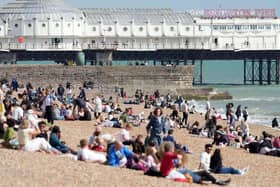 Beach-goers bask in bank holiday sun in Brighton. Photo: Eddie Mitchell