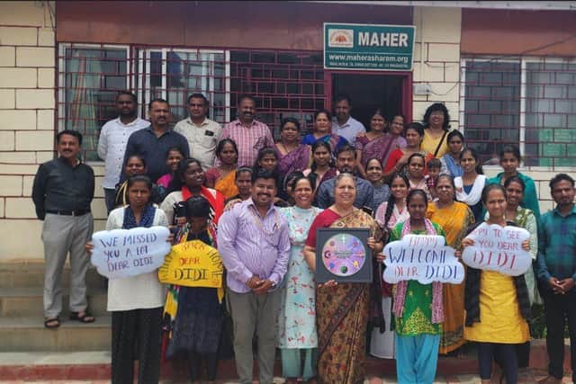 Founder and Director of Maher, Sister Lucy Kurien (centre). with the team and community in Pune.