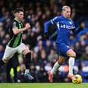 Mykhaylo Mudryk of Chelsea runs with the ball whilst under pressure from Billy Gilmour of Brighton & Hove Albion during the Premier League match between Chelsea FC and Brighton & Hove Albion at Stamford Bridge on December 03, 2023 in London, England. (Photo by Mike Hewitt/Getty Images)
