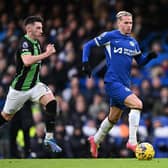 Mykhaylo Mudryk of Chelsea runs with the ball whilst under pressure from Billy Gilmour of Brighton & Hove Albion during the Premier League match between Chelsea FC and Brighton & Hove Albion at Stamford Bridge on December 03, 2023 in London, England. (Photo by Mike Hewitt/Getty Images)