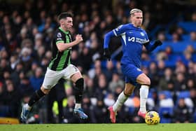 Mykhaylo Mudryk of Chelsea runs with the ball whilst under pressure from Billy Gilmour of Brighton & Hove Albion during the Premier League match between Chelsea FC and Brighton & Hove Albion at Stamford Bridge on December 03, 2023 in London, England. (Photo by Mike Hewitt/Getty Images)