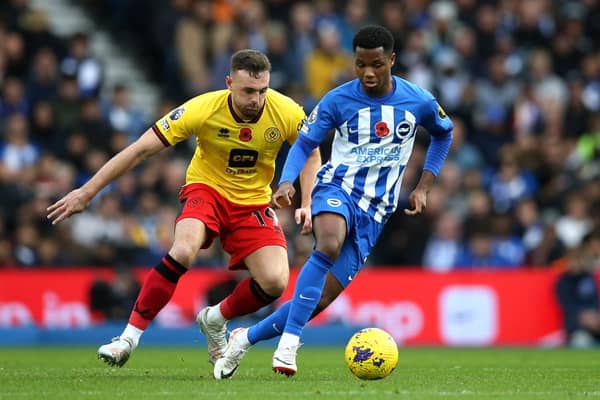 Ansu Fati is challenged by Jack Robinson of Sheffield United during the Premier League match between Brighton & Hove Albion and Sheffield United at American Express Community Stadium on November 12, 2023 in Brighton, England. (Photo by Steve Bardens/Getty Images)