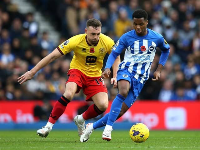 Ansu Fati is challenged by Jack Robinson of Sheffield United during the Premier League match between Brighton & Hove Albion and Sheffield United at American Express Community Stadium on November 12, 2023 in Brighton, England. (Photo by Steve Bardens/Getty Images)