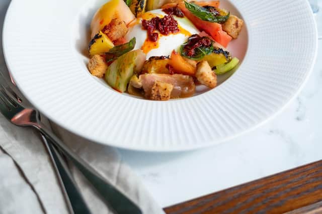 Heritage tomato panzanella, burrella, rose harissa, charred orange, roast garlic croutons