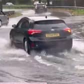 Vehicles navigating floodwater in Crawley this morning (November 27)