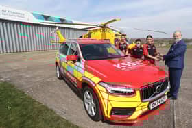Brian Dunne, District Governor of Rotary South East, handing over the keys of the new vehicle to air ambulance crew