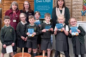 Pupils from The Horsell Village School, with some of Squire’s Woking’s Plant Experts (back left), during  their visit to Squire’s Woking, taking part in Squire’s Grow Your Own Chips initiative.