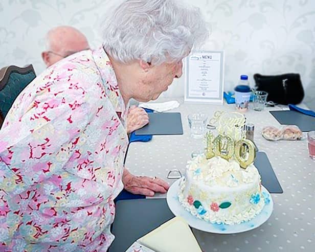 Centenarian, Joyce Douglas, Blowing Out Her Candles On Her 100th Birthday Cake at Redcot Residential Care Home in Haslemere