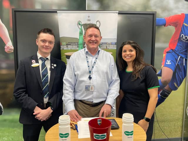 Davinia Hadley, practice manager at Specsavers Dorking, with optical advisor Fletcher O'Riordan and BBC Surrey sports editor Tim Durrans at the latest Specsavers Surrey Senior Cup draw in January 2025