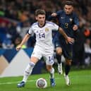 LILLE, FRANCE - OCTOBER 17: Billy Gilmour of Scotland controls the ball under pressure by Jonathan Clauss of France during the International Friendly between France and Scotland at Decathlon Arena on October 17, 2023 in Lille, France. (Photo by Mike Hewitt/Getty Images)