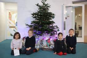 Pre-prep children at Highfield and Brookham with some of the hampers raffled for charity. Picture submitted