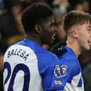 Jack Hinshelwood of Brighton & Hove Albion celebrates scoring his team's second goal with teammate Carlos Baleba during the Premier League match between Brighton & Hove Albion and Brentford FC at American Express Community Stadium on December 06, 2023 in Brighton, England. (Photo by Steve Bardens/Getty Images)