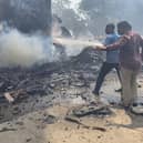Firefighters work at the site where Air India flight 171 crashed in a residential area near the airport in Ahmedabad on June 12, 2025. The London-bound passenger plane crashed on June 12 in India's western city of Ahmedabad with 242 on board, aviation officials said in what the airline called a "tragic accident". (Photo by Sam PANTHAKY / AFP) (Photo by SAM PANTHAKY/AFP via Getty Images)