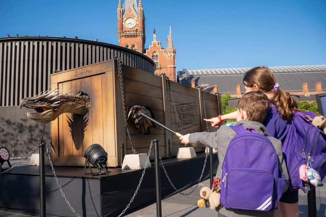 A 25-ft-long animatronic ‘Hungarian Horntail’ dragon surprises locals in [insert city] to mark the launch of the new ‘Triwizard Tournament – Making of Champions’ feature at Warner Bros. Studio Tour London, which celebrates the 20th anniversary of ‘Harry Potter and the Goblet of Fire’. Complete with a moving head, eyes and mouth, the ‘captured’ 1.3 tonne hydraulic dragon model roars and bares its teeth. The 'Triwizard Tournament – Making of Champions’ feature will run from May 15th to 8th September 2025.