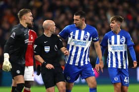 Lewis Dunk of Brighton & Hove Albion talks to Referee, Anthony Taylor during the Premier League match between Nottingham Forest and Brighton & Hove Albion at City Ground on November 25, 2023 in Nottingham, England. (Photo by Eddie Keogh/Getty Images)