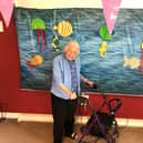 Resident Pam with the home's 'Under the Sea' picture