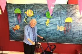 Resident Pam with the home's 'Under the Sea' picture