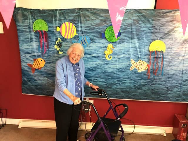 Resident Pam with the home's 'Under the Sea' picture