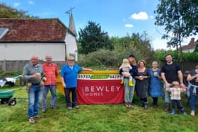Volunteers help with clean up operation in the village of Alfold