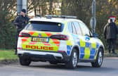 Armed police have been pictured on a road outside Gatwick Airport after a major security incident unfolded. Photo: Eddie Mitchell