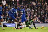 Kaoru Mitoma of Brighton & Hove Albion clashes with Ian Maatsen of Chelsea during the Premier League match between Chelsea FC and Brighton & Hove Albion at Stamford Bridge on December 03, 2023 in London, England. (Photo by Mike Hewitt/Getty Images)