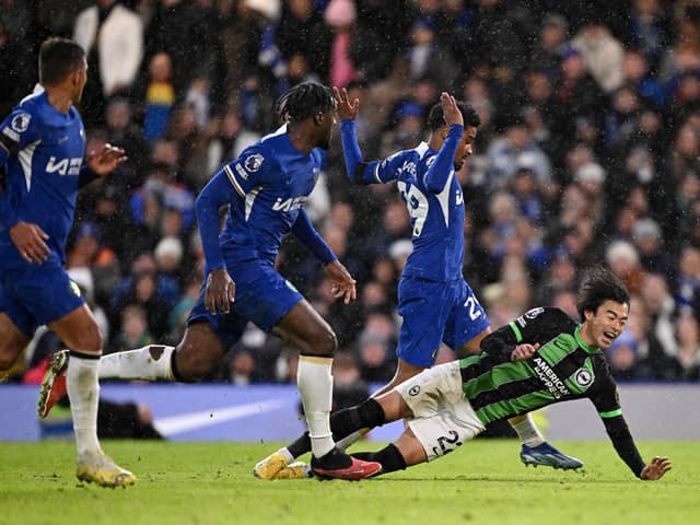 Kaoru Mitoma of Brighton & Hove Albion clashes with Ian Maatsen of Chelsea during the Premier League match between Chelsea FC and Brighton & Hove Albion at Stamford Bridge on December 03, 2023 in London, England. (Photo by Mike Hewitt/Getty Images)