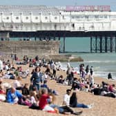 Beach-goers bask in bank holiday sun in Brighton. Photo: Eddie Mitchell