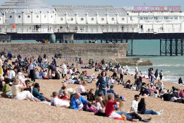 Beach-goers bask in bank holiday sun in Brighton. Photo: Eddie Mitchell