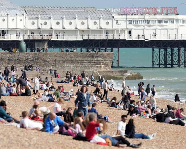 Beach-goers bask in bank holiday sun in Brighton. Photo: Eddie Mitchell
