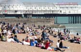 Beach-goers bask in bank holiday sun in Brighton. Photo: Eddie Mitchell